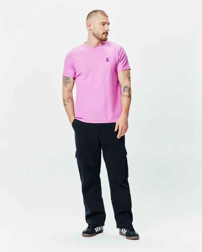 Mens Taylor Pique Tee, a classic fit pink pique t-shirt featuring a small embroidered purple Psycho Bunny skull logo on the left chest.