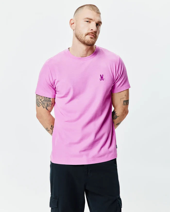 MENS TAYLOR PIQUE TEE, vibrant pink classic fit pique t-shirt featuring a small, embroidered magenta Psycho Bunny skull logo on the left chest.