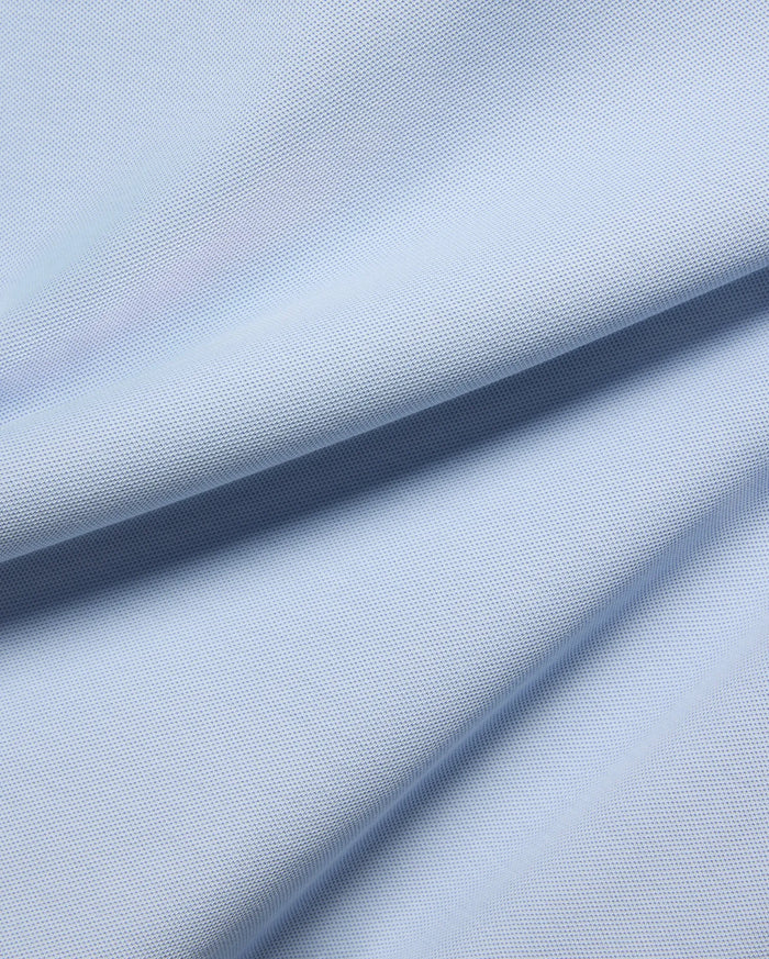 Light blue Mens Taylor Pique Tee fabric, a detailed close-up showcasing the premium, breathable textured pique knit, ideal for bold Psycho Bunny streetwear.