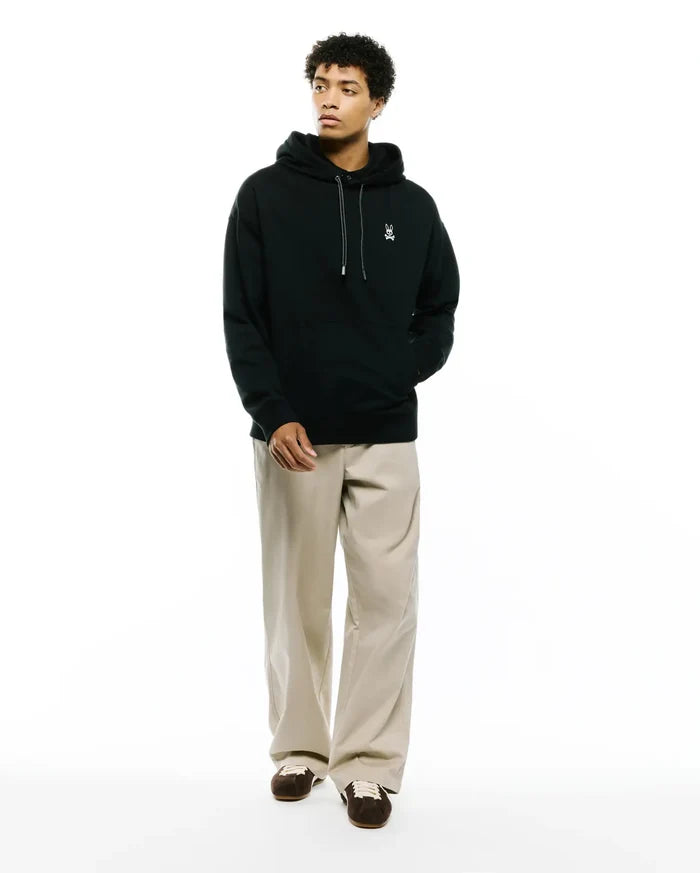 Mens Terrence Fleece Hoodie, black relaxed fit with soft fleece texture, featuring a small white embroidered Psycho Bunny skull logo on the left chest and white contrast drawstrings.