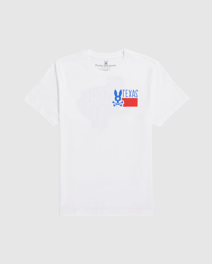 A plain white men's Psycho Bunny Texas tee laid flat, featuring a graphic print with the word "TEXAS" in block letters and a stylized blue and red design underneath, positioned slightly off-center towards the left.
