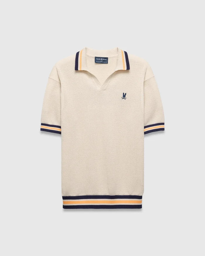Mens Theros Knit Polo, cream textured knit with a relaxed fit, featuring a V-neck, navy and orange striped ribbed collar, cuffs, and hem, and a small embroidered navy Psycho Bunny skull logo on the left chest.