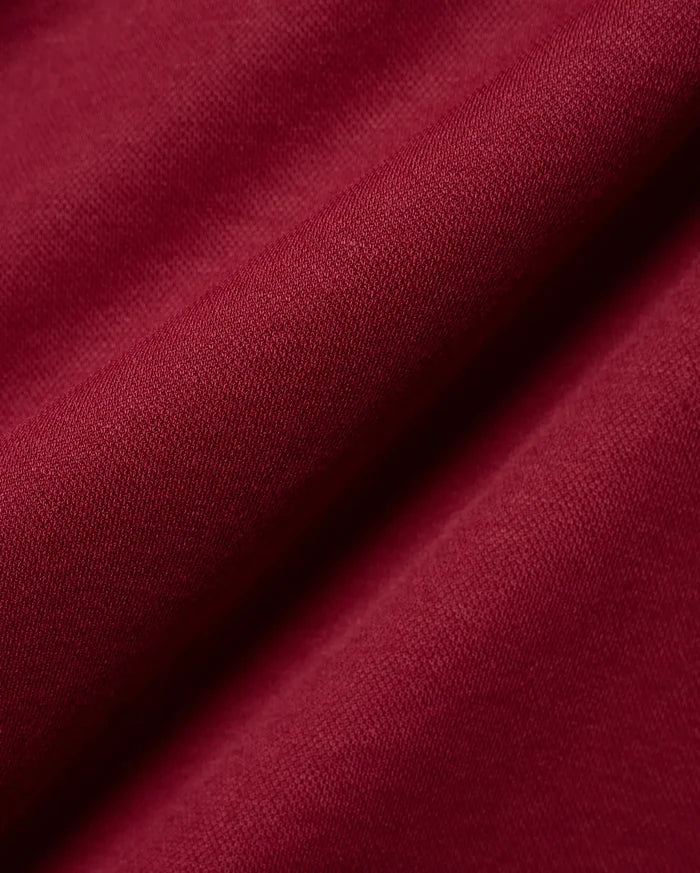 Mens Timmy Interlock Polo in a luxurious deep burgundy, highlighting the premium, smooth interlock knit fabric with its refined, subtle texture and elegant, soft drape.