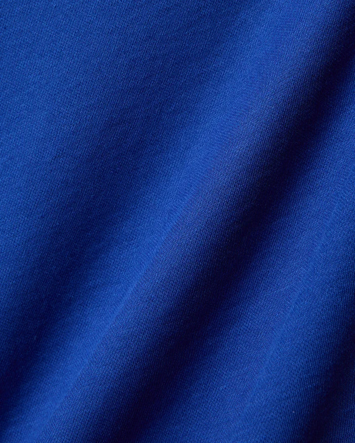 Mens Timmy Interlock Polo in a rich, vibrant royal blue, crafted from premium, soft interlock knit fabric, showcasing its refined texture and elegant drape, perfect for sophisticated streetwear.