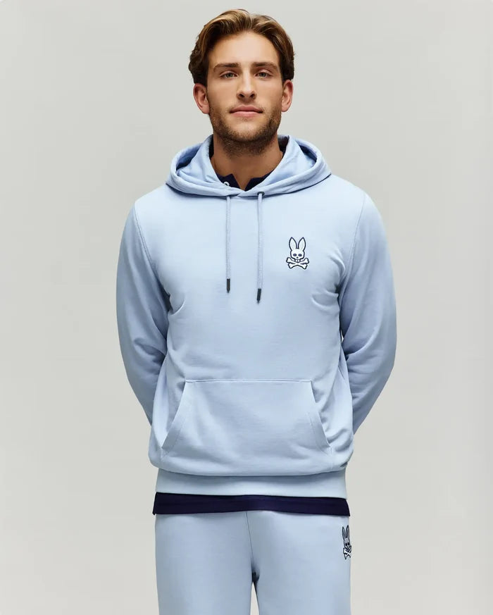 Mens Timothy 4k Bunny Hoodie, a light blue classic fit jersey hoodie featuring a dark blue embroidered bunny skull logo on the left chest, drawstring hood, and kangaroo pocket.