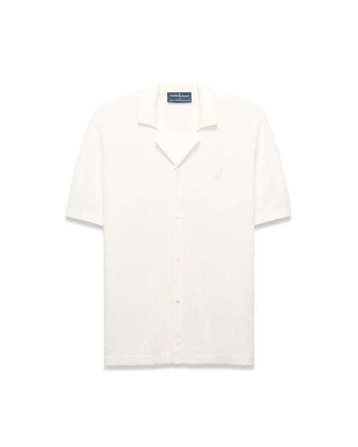 Mens Yann Knit Shirt, cream ribbed knit, short-sleeve, full button-front, camp collar, with a small embroidered Psycho Bunny skull logo on the left chest, classic fit.