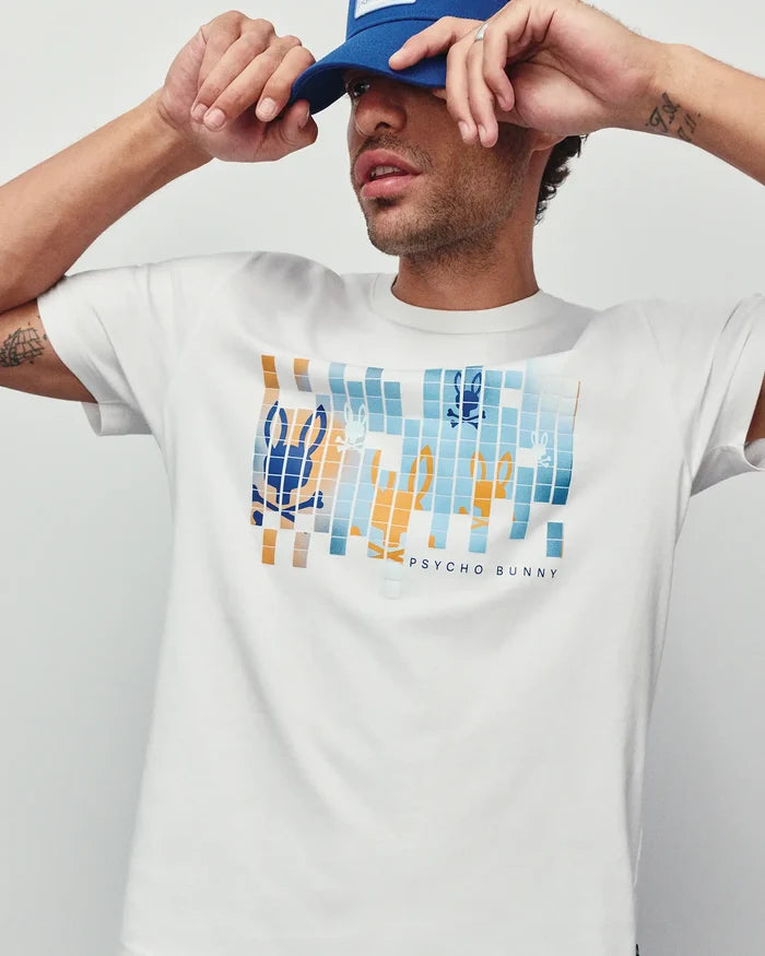 Mens Zander Graphic Tee, white classic fit jersey t-shirt featuring a large pixelated blue and orange Psycho Bunny skull logo graphic on the chest with Psycho Bunny text.
