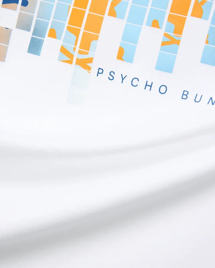 White Mens Zander Graphic Tee with a vibrant pixelated orange, light blue, and beige graphic print, featuring the signature dark blue PSYCHO BUNNY text logo prominently on the front chest, crafted from soft jersey.