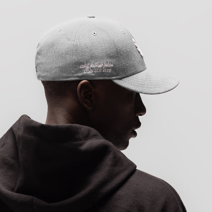 New Era 59Fifty Low Profile Hat in heather grey with white embroidery, side profile on model