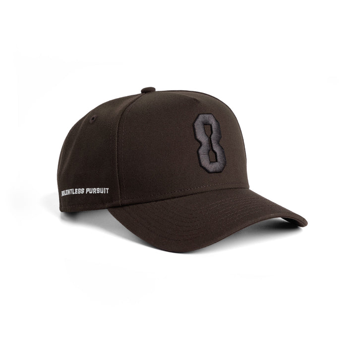 Flatlay of New Era 9Forty A-Frame Hat in Dark Earth with embroidered 8 logo, side view