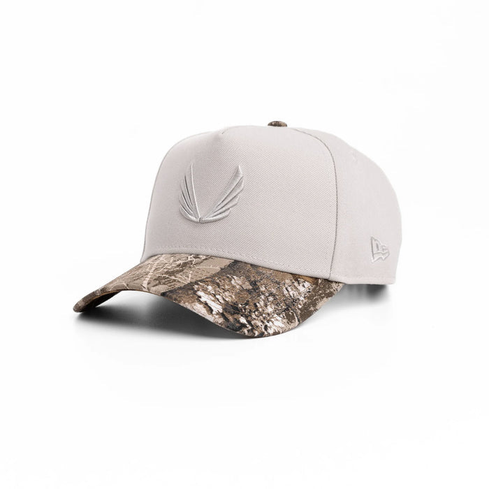 flatlay New Era 9Forty A-Frame Hat in stone and realtree camo, angled view