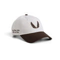 Flatlay of New Era 9Twenty strapback hat in stone and dark earth two-tone, front three-quarter view