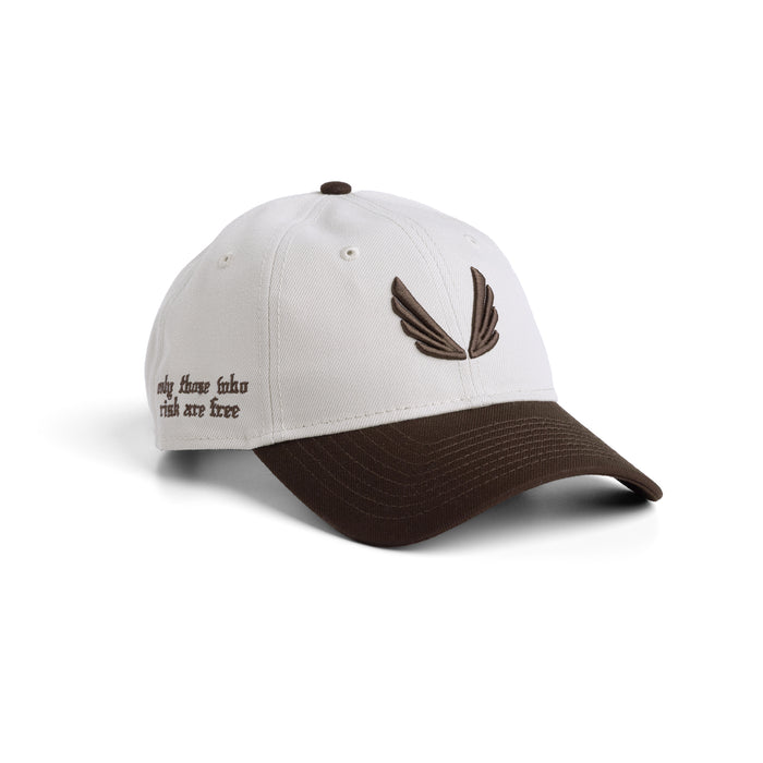 Flatlay of New Era 9Twenty strapback hat in stone and dark earth two-tone, front three-quarter view