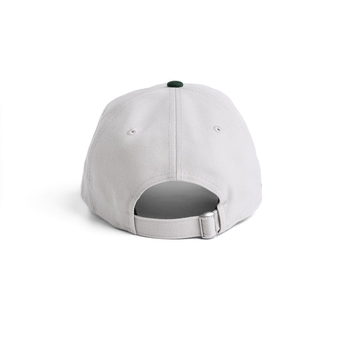 flatlay New Era 9Twenty strapback hat in stone and forest green, back view