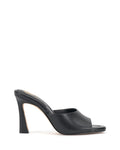 The Vince Camuto Paigely Mule is a black high-heeled minimalist mule featuring an open toe and a sleek, flared heel design, shown in side profile on a white background.