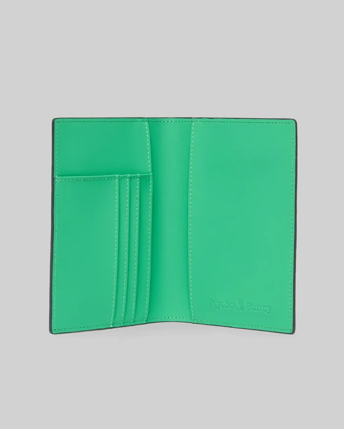 Passport Holder with a smooth, vibrant green interior and black trim, featuring multiple card slots and an embossed Psycho Bunny logo on the right, accented with white stitching.