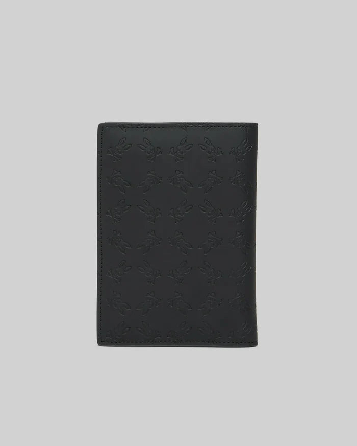 Black Passport Holder featuring a refined, all-over embossed Psycho Bunny skull logo pattern on its smooth, premium leather-like surface, showcasing distinctive brand identity.