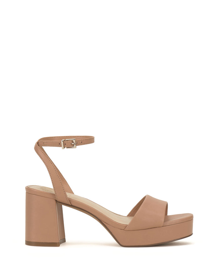 Step out in style with the Pendreya Platform Sandal by Vince Camuto—a tan, open-toe block heel sandal featuring an ankle strap with buckle, a platform sole, and simple straps across the front. These sleek platform sandals offer a subtle retro vibe perfect for any occasion.