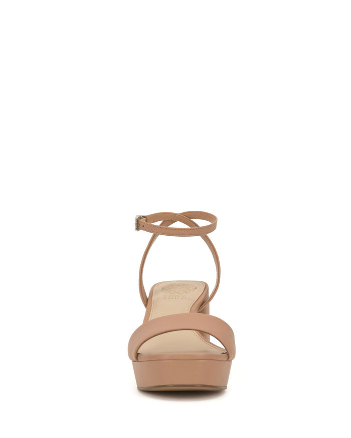 Front view of the Vince Camuto Pendreya Platform Sandal in tan, an open-toe style featuring a thick front strap and a slender ankle strap with a small buckle. This chic block heel design provides a comfortable lift and smooth finish, seamlessly combining retro-inspired charm with modern comfort.