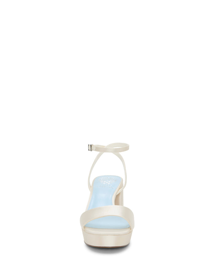 Front view of the Vince Camuto Pendreya Platform Sandal in ivory, featuring a block heel, ankle strap, and light blue cushioned insole, photographed against a white background.