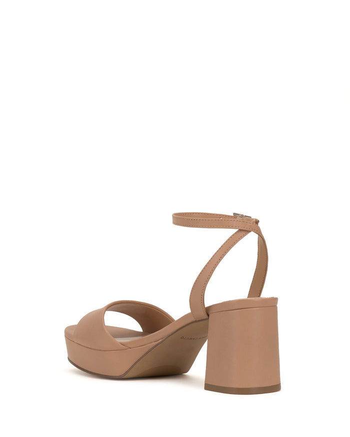 The Vince Camuto Pendreya Platform Sandal is shown from the back, highlighting its tan color, chunky block heel, peep toe, and ankle strap with buckle, all set against a white background.
