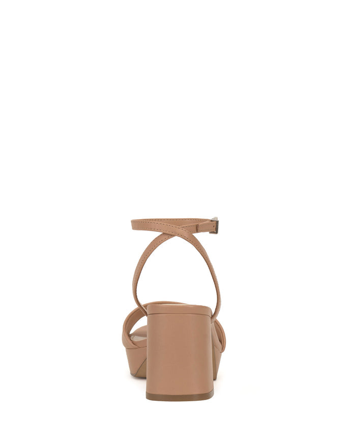 Rear view of the Pendreya Platform Sandal by Vince Camuto, a beige open-toe style featuring a block heel and ankle strap, shown against a white background.