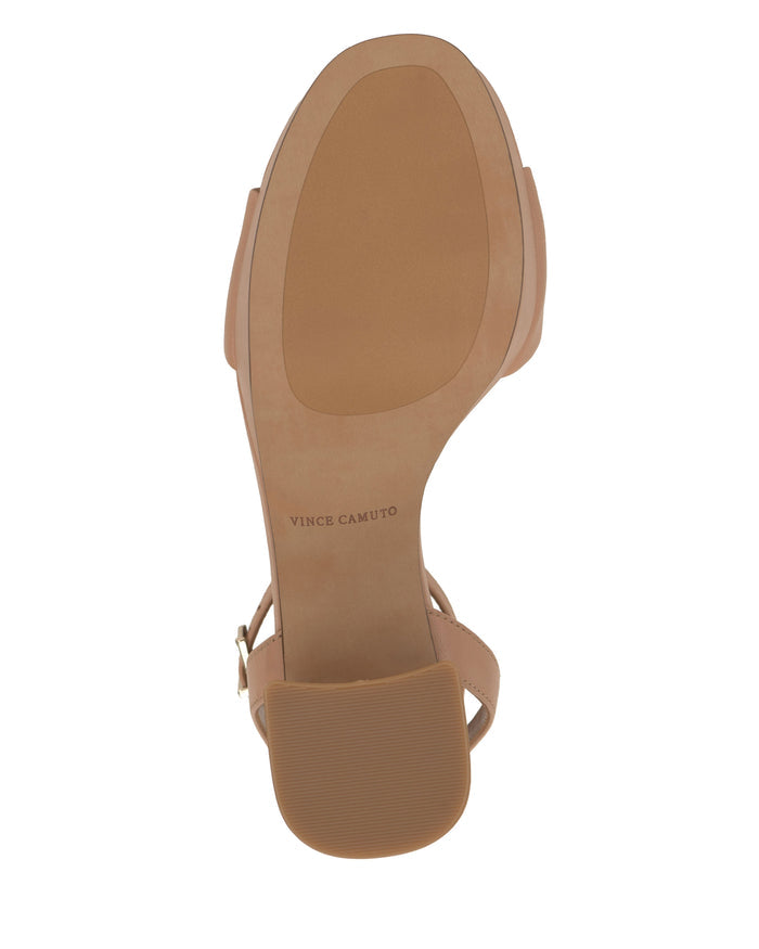 Beige Pendreya Platform Sandal shown from the bottom, displaying the sole and heel tread. The Vince Camuto logo is printed on the sole near the heel area, highlighting this stylish block heel design.