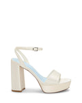 Introducing the Pendry Platform Sandal by Vince Camuto—a cream-colored, retro-inspired high-heeled sandal featuring an ankle strap with buckle, open toe design, and a sturdy block heel, beautifully displayed on a white background.