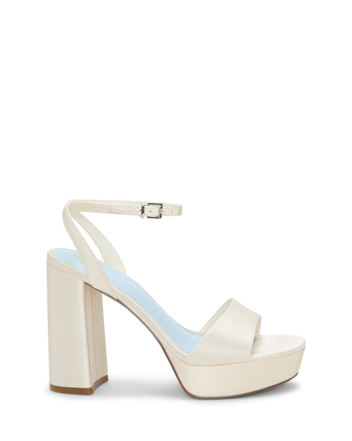 Introducing the Pendry Platform Sandal by Vince Camuto—a cream-colored, retro-inspired high-heeled sandal featuring an ankle strap with buckle, open toe design, and a sturdy block heel, beautifully displayed on a white background.