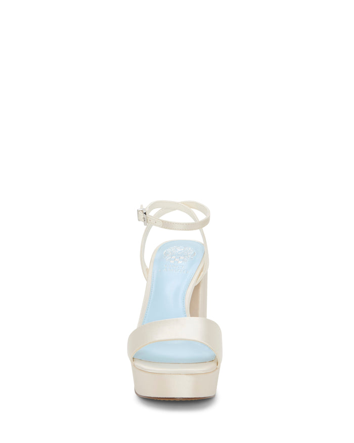 Front view of the Vince Camuto Pendry Platform Sandal, a single ivory high-heeled sandal with a light blue insole, ankle strap, and open toe, featuring a stylish block heel that adds a subtle retro vibe—all displayed on a white background.