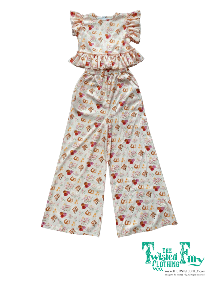 Children's outfit with ruffled top and wide-leg pants on a white background, branded 'The Twisted Filly'.