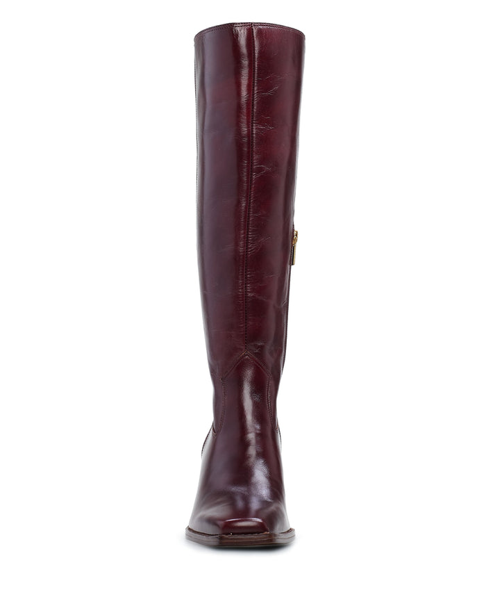 Front view of the Vince Camuto Sangeti Wide Calf Boot in burgundy leather, showcasing its smooth, shiny finish. This tall boot features a rounded toe, a subtle block heel, and a convenient side zipper for easy wear.