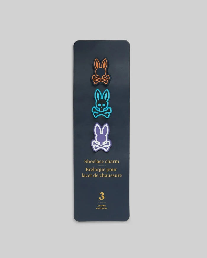 Psycho Bunny Shoe Lace Charms set featuring three iconic bunny skull logos in vibrant orange, blue, and purple, outlined in black, on a dark grey card.