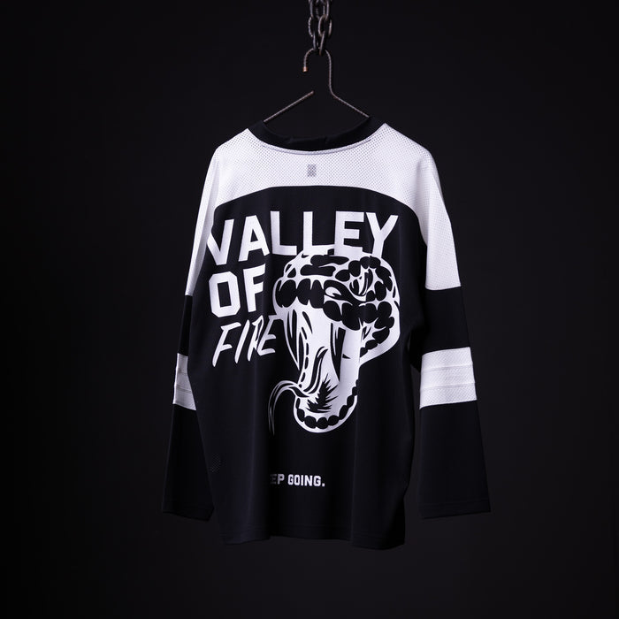 SM'23 long-sleeve jersey in black and white, hanging on hanger with 'Valley of Fine' graphic