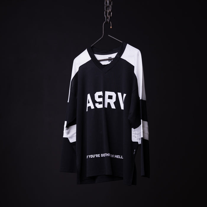 SM'23 long-sleeve jersey in black and white on hanger against dark background