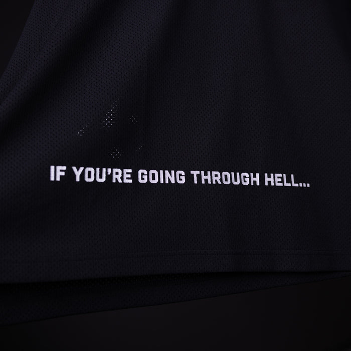 SM'23 long-sleeve jersey in black, worn and displaying motivational text graphic
