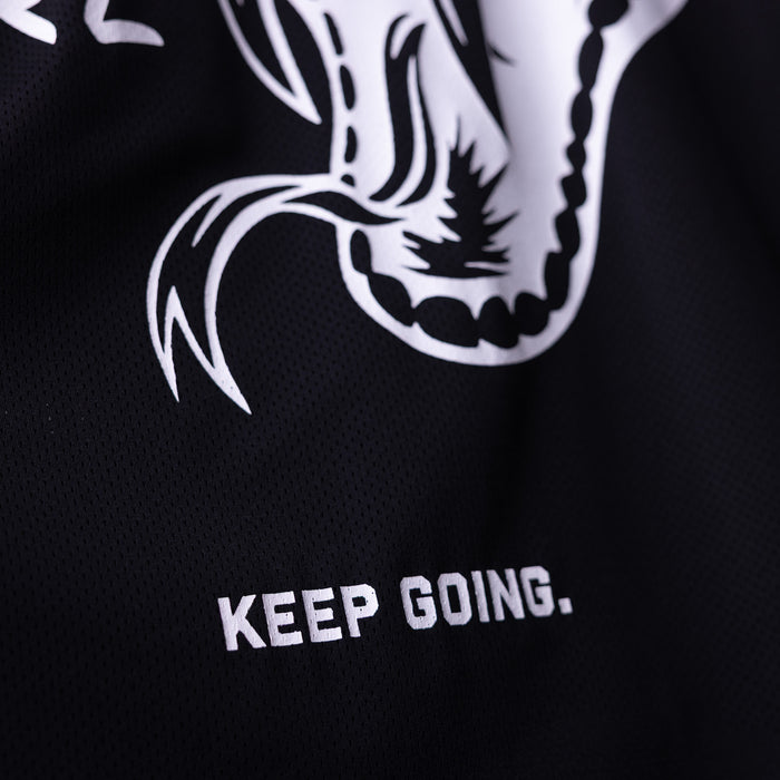 SM'23 long-sleeve jersey in black with white graphic and 'Keep Going' text, detail shot