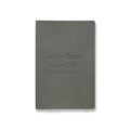flatlay Soft Cover Notebook in grey with embossed OTWR text, front view