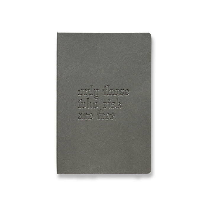 flatlay Soft Cover Notebook in grey with embossed OTWR text, front view