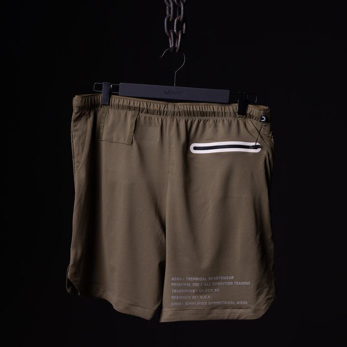SP'19 7" Linerless Short in khaki, displayed on hanger against black background