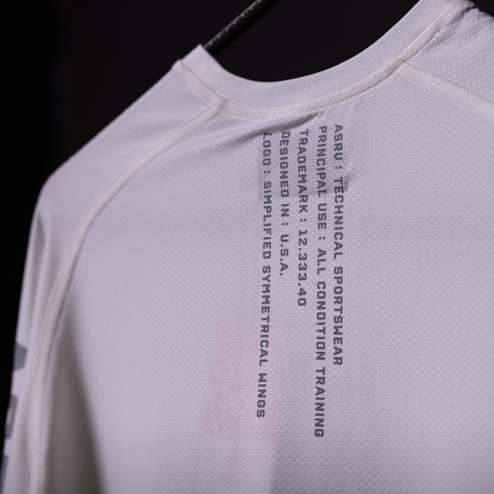 SP'20 Long Sleeve Shirt in white, closeup of chest graphic and care instructions