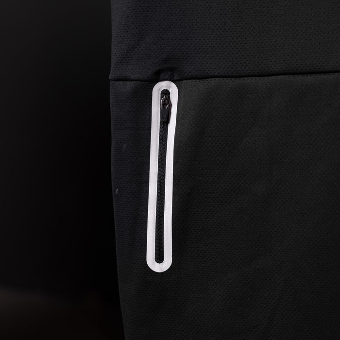 SP'20 Mesh Utility Tank detail shot of white zippered pocket on black fabric