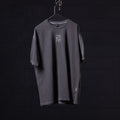 SP'22 Stone Washed Oversized Tee in charcoal gray displayed on hanger