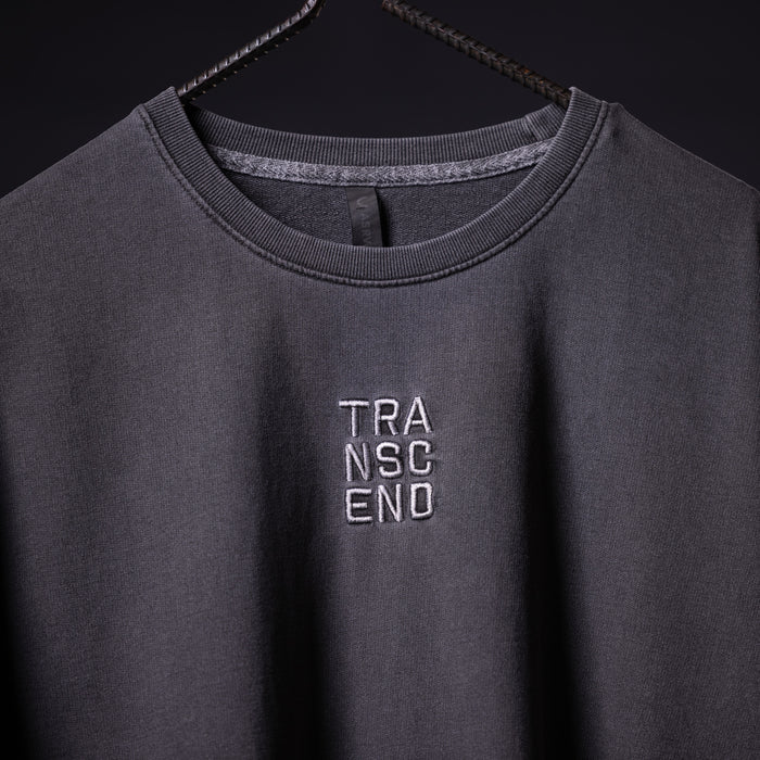 SP'22 Stone Washed Oversized Tee in charcoal gray on hanger, front view with TRANSCEND embroidery