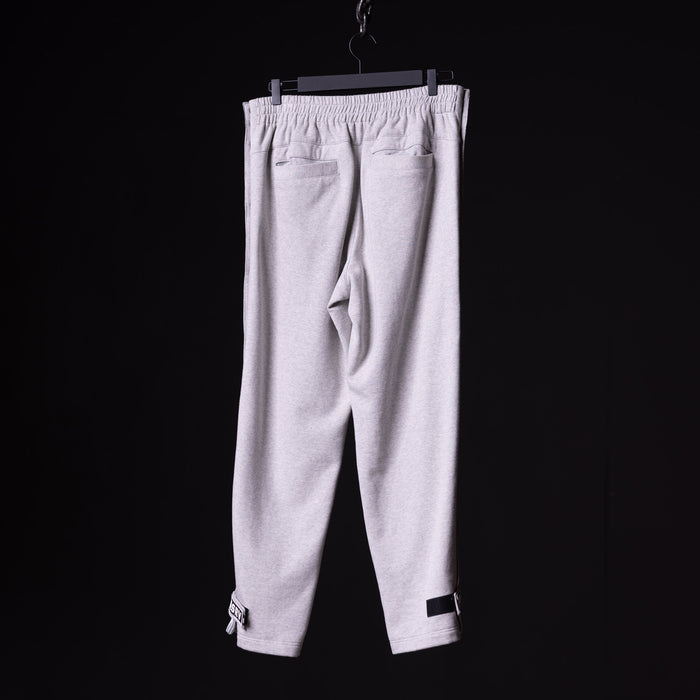 SP'22 Tearaway Jogger in light gray, displayed on hanger against black background