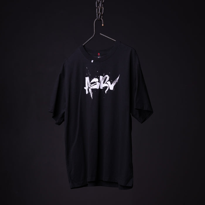 SP'23 Graphic Tee in black with white logo, displayed on hanger against dark background