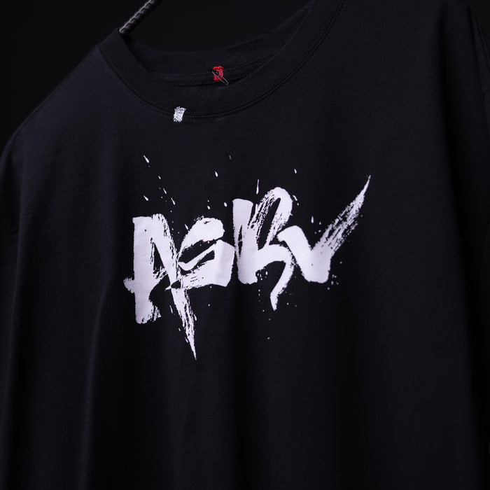 SP'23 Graphic Tee in black with white distressed logo design, worn on model