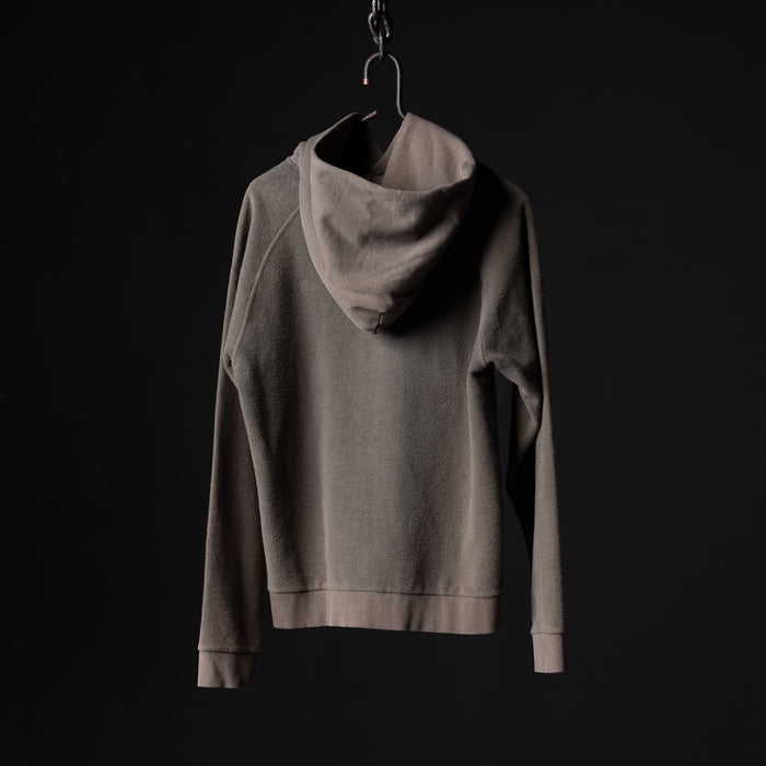 SS'20 Reverse Weave Hoodie in grey displayed on hanger against black background