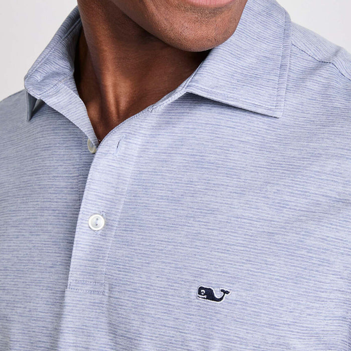 Vineyard Vines Men's Short Sleeve Polo in Hammerhead, sizes S-XXL. Close-up of chest showing buttons and stitched whale logo on striped fabric. Color is a muted blue and white small stripes.