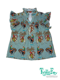 Children's shirt with cowboy print and 'The Twisted Filly' branding on a white background